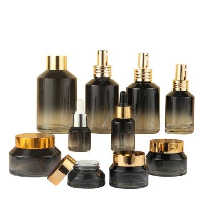 China Latest New Design 100ML Cosmetic Luxury Black Gold Round Empty Perfume Bottle Full Set Cosmetic Packaging Glass Bottle With Pump for sale