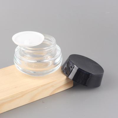 China Popular Clear 50G Personal Care Anti Wrinkles Face Skin Care Glass Packaging Eye Cream Jar Oil Cream Cosmetic Packaging Jars for sale