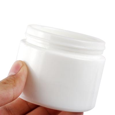 China Personal Care Supply Amazing Quality 100g White Ceramic Cosmetic Glass Jar With Plastic Cap White Cosmetic Facial Cream Jar for sale