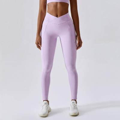 China Lulu Nude Yoga Pants Hip Lift Pocket Fitness Tight Running Pants Women Cross Waist Quick-drying European-American Pants Anti-pilling Tight for sale