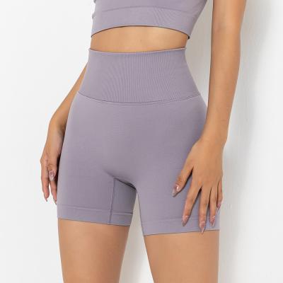 China Anti-pilling New Solid Color Peach Stretch Tight Sports Tight Hip Seamless Lift Yoga Pants High Waist Fitness Seamless Shorts for sale