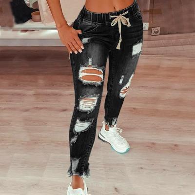 China European summer Anti-wrinkle elastic waist women's jeans border thin feet and American high slim fit hole small lace up pants for sale