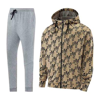 China 2021 Men's Tracksuit Anti-UV Polyester Logo Custom Embroidery Sportswear Tracksuit Set Streetwear Anorak Jogging Set for sale