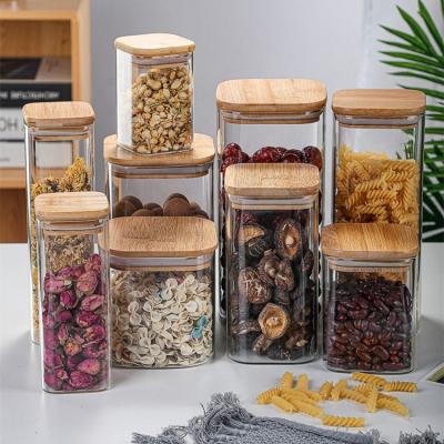 China Microwavable Airtight Glass Storage Canister with Clear Lid Food Storage Container Jar with Sealing Bamboo Lid for Noodle Flour Cereal for sale