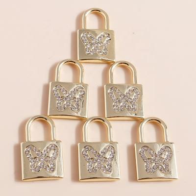 China Durable 4pcs/bag 21*13mm Exquisite Gold Plated Metal Crystal Butterfly Lock Pendants Custom DIY Jewelry Making Accessories for sale