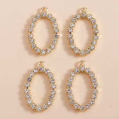 China 4pcs/bag 27*15mm Crystal Number Letter Circle Oval Durable Luxury Design Pendant Bracelets Earrings Necklace Jewelry Accessories for sale