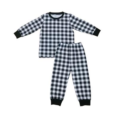 China Breathable New Fashion Black And White Plaid Clothing Sets Knit Fabric Pajamas Boys Pajamas Sets for sale