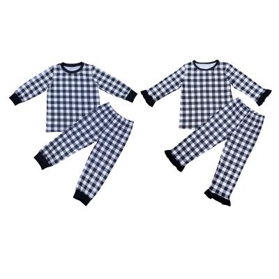 China Breathable High Quality Black Plaid Long Sleeve Baby Boy Girls Pajamas Sets Use Two Piece Silk Pajamas For Kids for sale