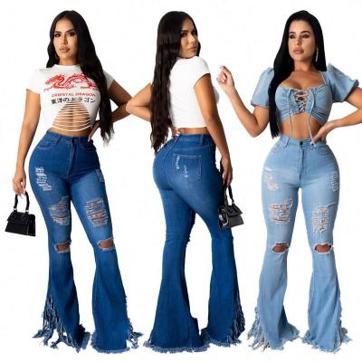 China Sexy QUICK DRY Summer Teams 2021 Vendor Washed Holes Fringed Flare Blue Stretchy Skinny Jeans Stretch Denim Fabric Fringe for sale