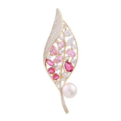 China Safety Pin Brooch Pin Supplier Luxury Gold Plated Colorful Zircon Pearl Feather Shape Brooch Pin For Ladies for sale