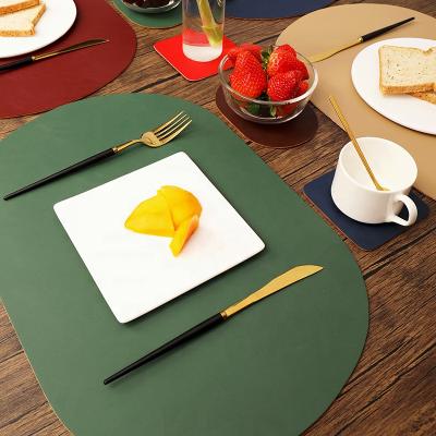 China NEW Personalized Non Slip Heat Resistant Colored Print Non Slip Dining Table Mat PU Waterproof Washable Leather Place Mats for sale