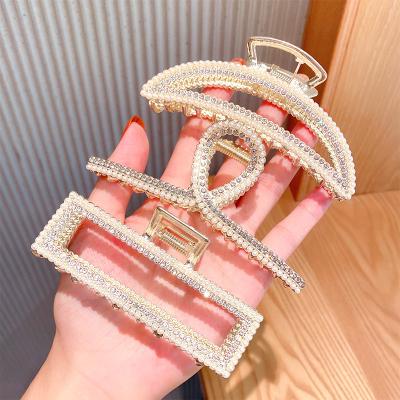 China Pearl Elegant Metal Rhinestone Geometric Hollow Crab Barrette Ponytail Holder Holds Large Hair Claw Clips for sale