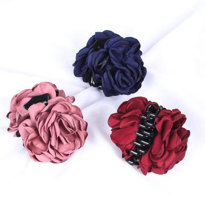 China Camellia Fabric Flower Hair Accessories Ponytail Holder Soft Plastic Hair Holds Large Hair Claw Clips for sale