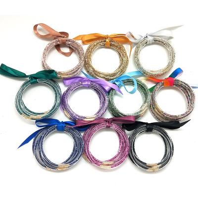 China 2022 TRENDY Custom Plastic Ladies Bowknot Bracelet 5pcs Bracelets Set With Ribbon Glitter Many Colors for sale