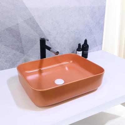 China Matte Black Bathroom Vanity Sink Luxury One Piece Slim Edge Cabinet Ceramic Hand Sink for sale