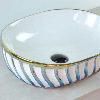 China Diamond Colored Bathroom Sinks Electroplated Easy Clean Luxurious Gold Ceramic Pedestal Sink for sale