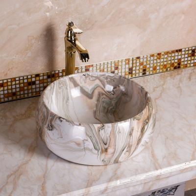 China New Ceramic Round Art Hand Wash Basin Ceramic Sink Transfer Printing Water Test Easy Clean Small Size Countertop Bathroom for sale