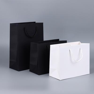 China LOW MOQ Paper Bag Shopping Paper Bag Biodegradable Custom Luxury Black Luxury Gift Wrapping Apparel Paper Bag With Branded Logo for sale