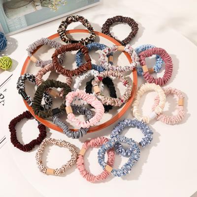 China Environmentally Friendly Hot Selling Crinkle Thin Hair Ties Solid Color Ins Hair Thin Tie Ponytail Holder Hair Ties For Women for sale