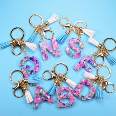 China Hot Sale Acrylic Letter Key Chain Double Printed Tassel Plush Pony Car Bag Pu Women Key Chains for sale