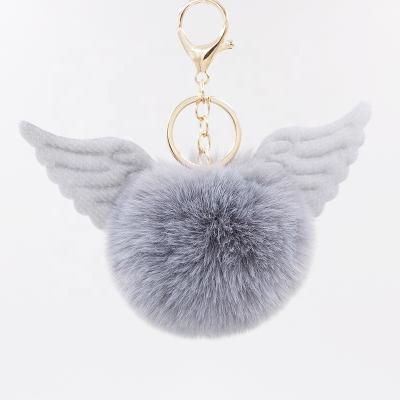 China Eco-Friendly Angel Wings Creative Faux Fur Ball Car Pendant Custom Key Chain for sale