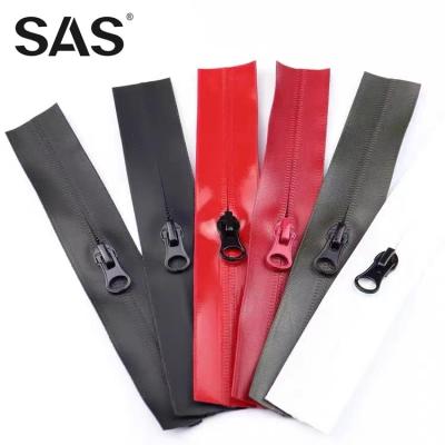 China Best Selling Different Color Customized Auto Lock SAS Logo Length Waterproof Zipper Slider For Clothing for sale