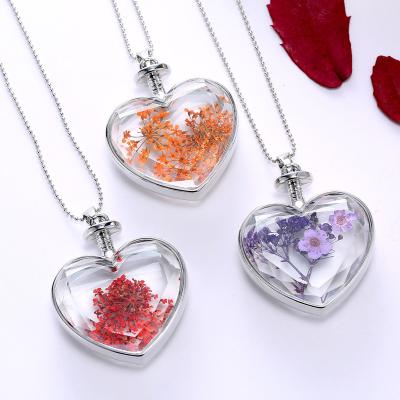 China Amazon Best TRENDY Selling Heart Shape Pressed Glass Necklace Pendant Gift Dried Flower Jewelry for sale