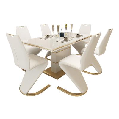 China Sturdy Gold And White Dining Table 6 Chairs And Luxury Modern Dining Table Sets for sale