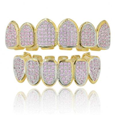 China Hiphop Hip Hop Gold Color Grills Teeth Grillz Micro Pave Iced Pink Zircon Off Upper Lower Grills Set Vampire Tooth Mouth Jewelry for sale