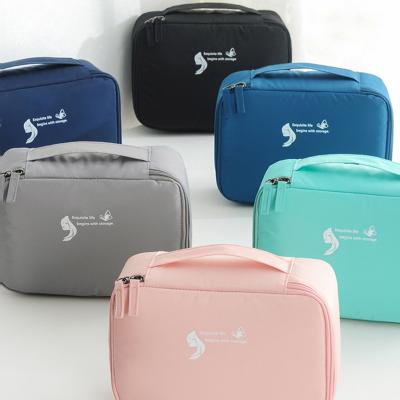 China New Memory Fabric Waterproof Amazon Travel Cosmetic Bag For Women Men Makeup Bags Box Large Capacity Blue Travel Makeup Bag for sale