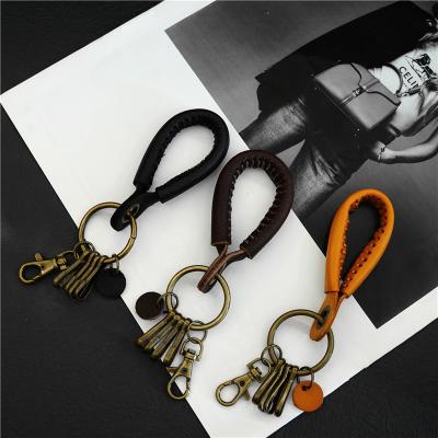 China Creative zinc alloy car thick keychain rope gift keychain vegetable tanned handmade leather keychain men's and women's leather key chain for sale