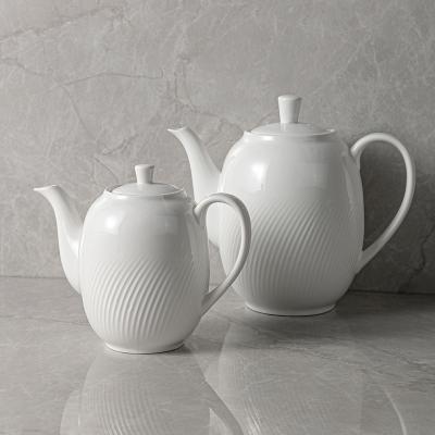 China Sustainable Porcelain Pot Tableware Coffee Teapots With Elegent Embossed Pattern To Marry Hotel Porcelain Ceramic White Fine Vajjila Teapot for sale