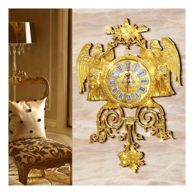 China Creative Angel Art Wall Clock Gold Mute Decorative Clock Home Style Antique Living Room Wall Clock for sale