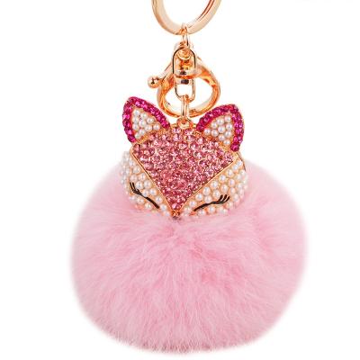 China Luxury Plush Pom Pom Keychains Fashion Pearl Rhinestone Fox Fur Key Chain 2021 Hot Sale Christmas Gifts for sale