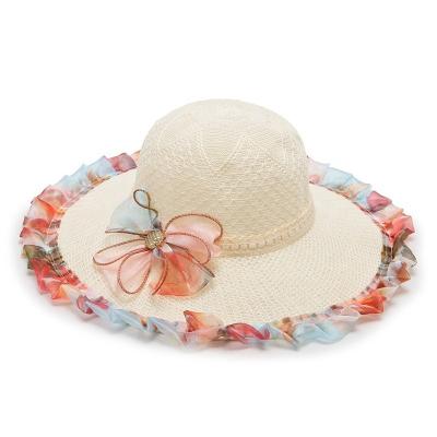 China New Women's Large Character Seaside Beach Hat Travel Bow Sun Hat With Flower Decoration for sale