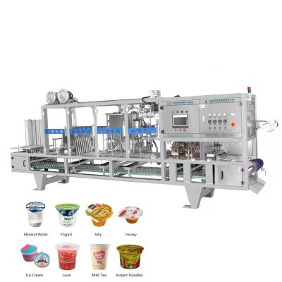 China Full Automatic Food Paper Cup Filling Sealing Machine for Juice Water Yogurt Tea Milk for sale