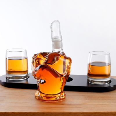 China Amazon Hot Sale Modern Whiskey Decanter Middle Finger Shape Glass Whiskey Decanter Set Wooden Frame Base for sale