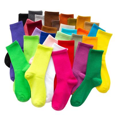 China QUICK DRY Sports Unisex Crew Socks Colorful Solid Cute Candy Branded Custom Straight Pile Sock for sale