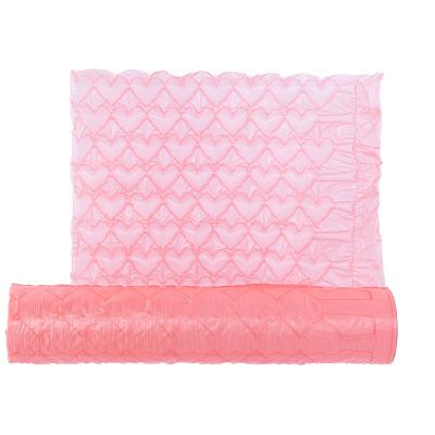 China HDPE Custom Perforated Pink Heart Shaped Air Bubble Cushion Wrap Protective Roll Packaging Cosmetics Packaging And Cushioning Material for sale