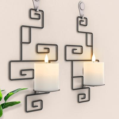 China New Arrival Hot Sale Pattern Design Black Iron Metal Wire Wall Hanging Pillar Candle Holders Diverted Holders for sale