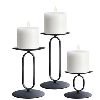 China Wholesale Tabletop Geometric Oval Iron Design Novelty Fashion Pillar Metal Plate Black Candle Holders for sale