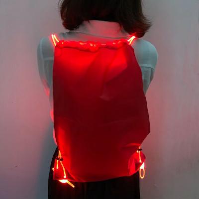 China Ployester Factory OEM Outdoor Glowing Nylon Led Backpack Night Cycling Led Drawstring Bag for sale