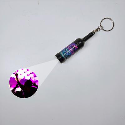 China Projector your logo; show your brand MIni Champagne bottle light led key chain spotlight with logo led key ring for champagne for sale