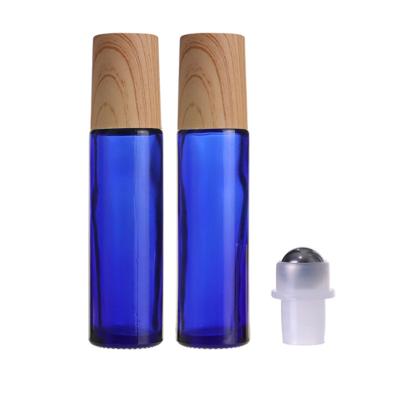 China Cosmetic Cheap Essential Transparent Oil Perfume 10ml 15ml Roll On Roller Glass Bottle With Lid And Bamboo Rollers for sale