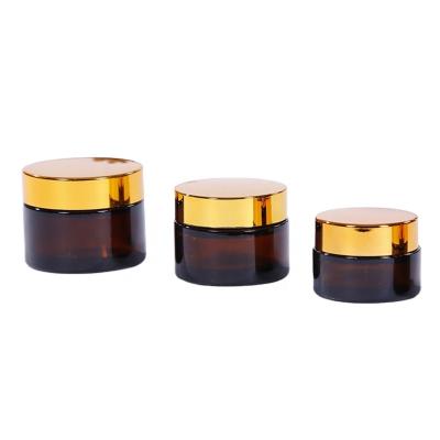 China Amber Face Cream Glass Jar Cosmetic Empty Eye Cream Containers With Lid for sale