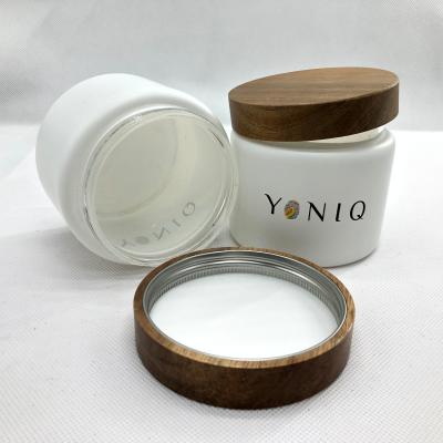 China Wholesale Food Factory Customized Logo Glass Jar Wood Top Matte White Glass Jar 8oz for sale