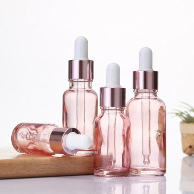 China Good Cosmetics Choose Essential Oil Cheap Serum Pink Bottle Rose Gold Cap Cosmetic Glass Dropper Bottle for sale