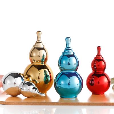 China Cosmetic cosmetic packaging plate gourd shape glass bottle essential oil pill capsule glass bottle for sale