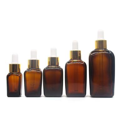 China Cosmetic Wholesales Empty Rectangle Amber Square Frosted Glass Bottle With Dropper For Essential Oil Perfume Packaging for sale