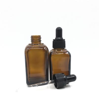 China 30ml 50ml New Cosmetic Clear Glass Bottle Square Transparent Essential Oil Bottle With Black Plastic Dropper for sale